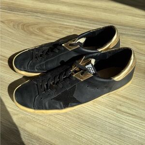Authentic Golden Goose Super-Star LTD in black leather and gold accents size 44